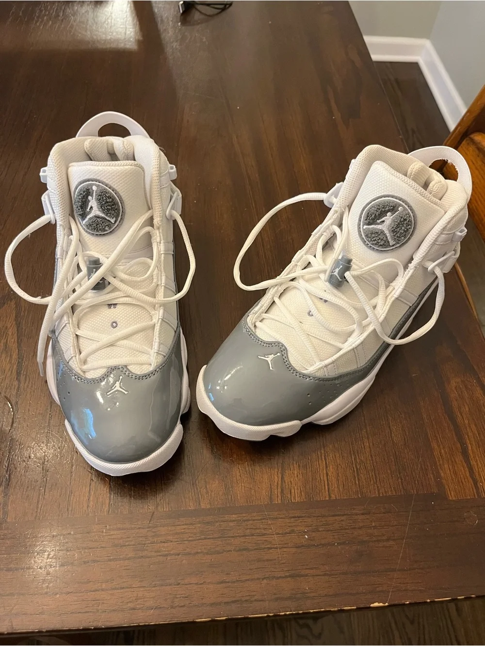 Jordan Kids High-Top Sneakers in White and Grey Patent